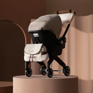 Evenflo® Shyft™ DualRide™ Infant Car Seat - Stroller Combo with Carryall Storage Champagne